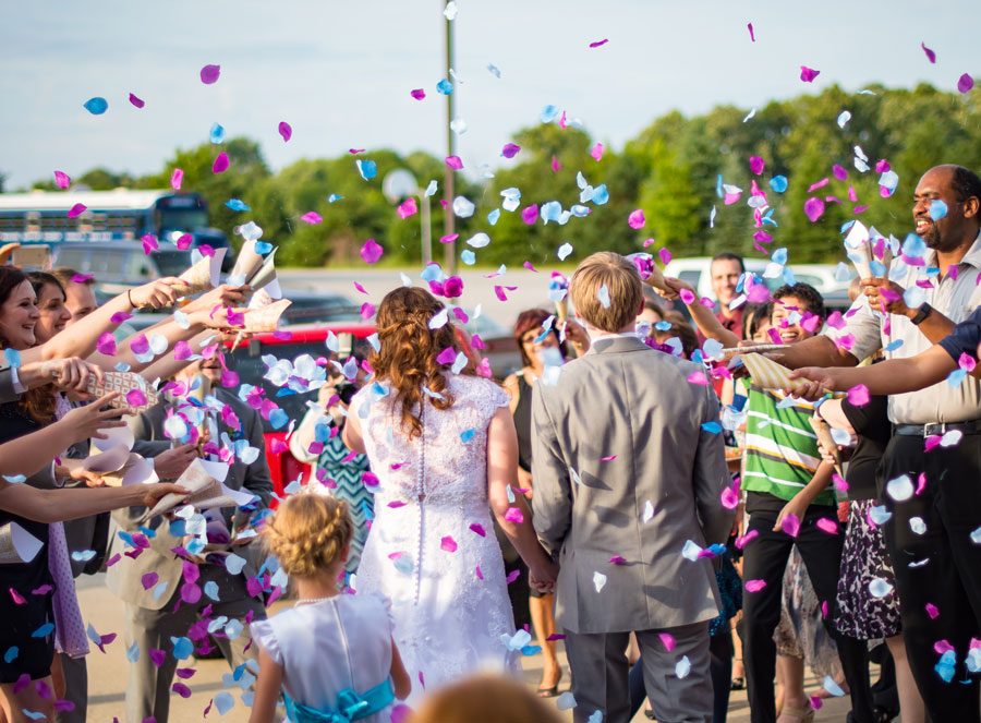 Guests celebrating outside after a wedding